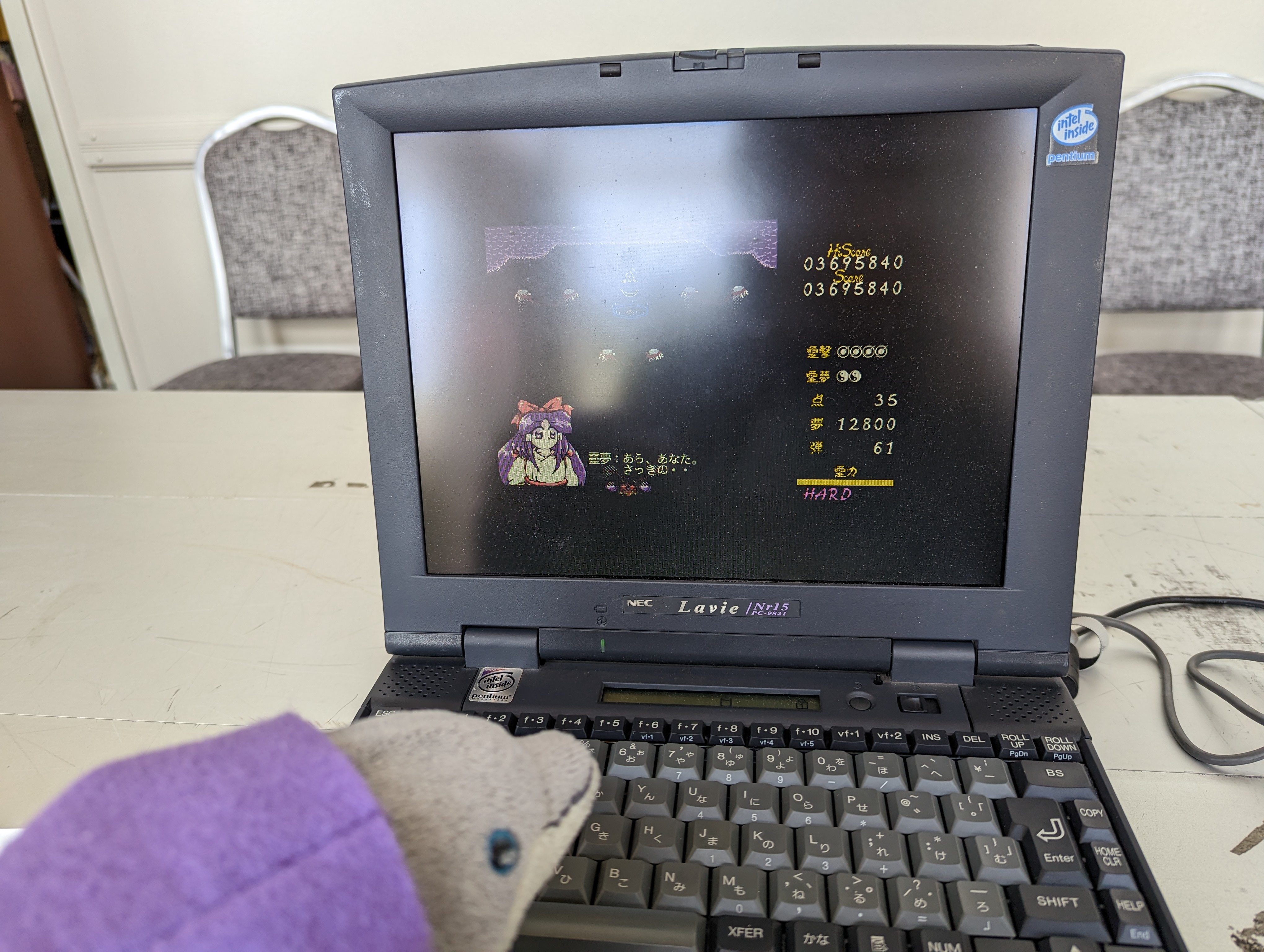 Picture of willie the dolphin and a real PC98 machine playing Touhou