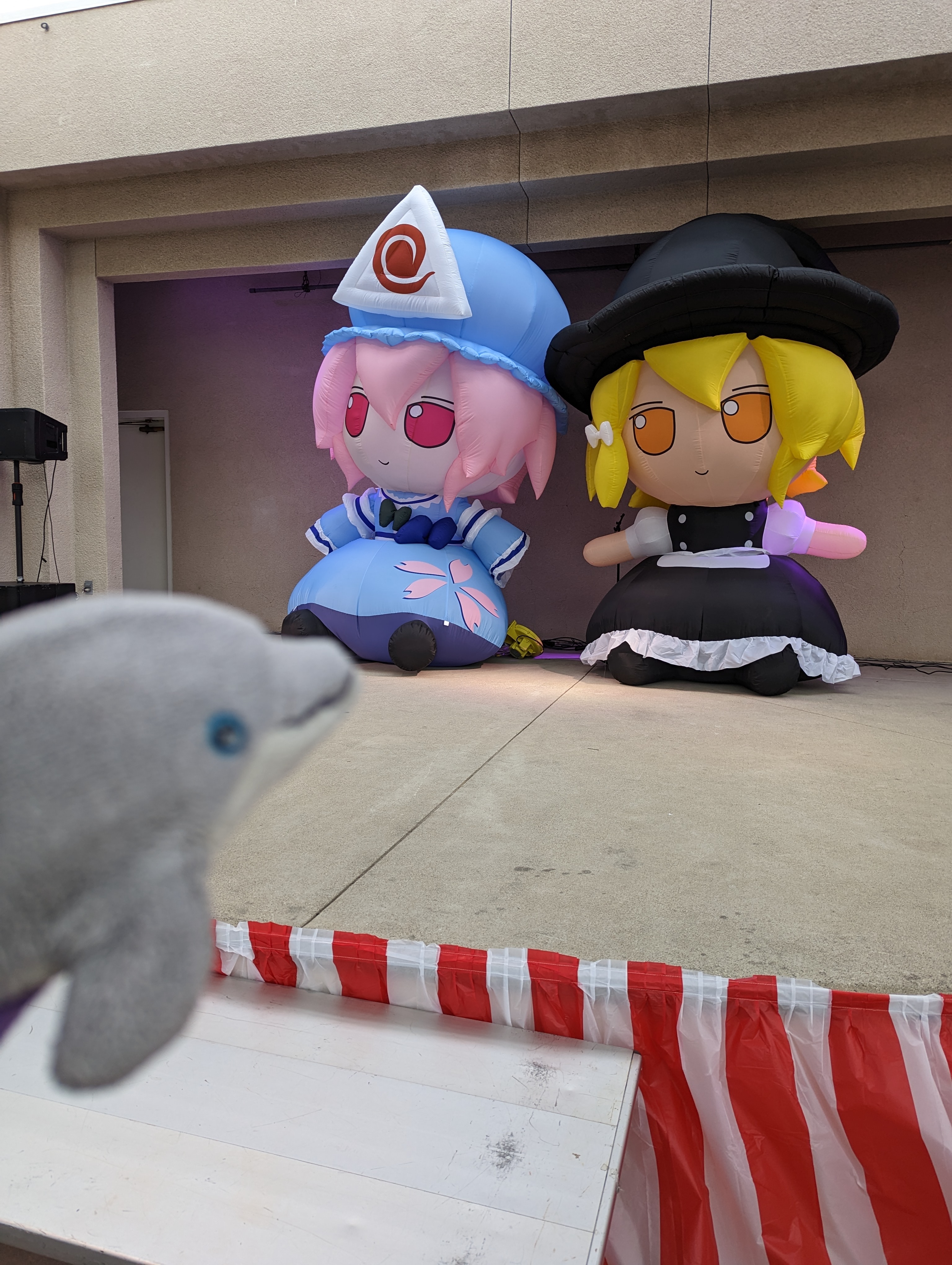 Picture of both the Yuyuko and Marisa inflatable fumos on the main stage